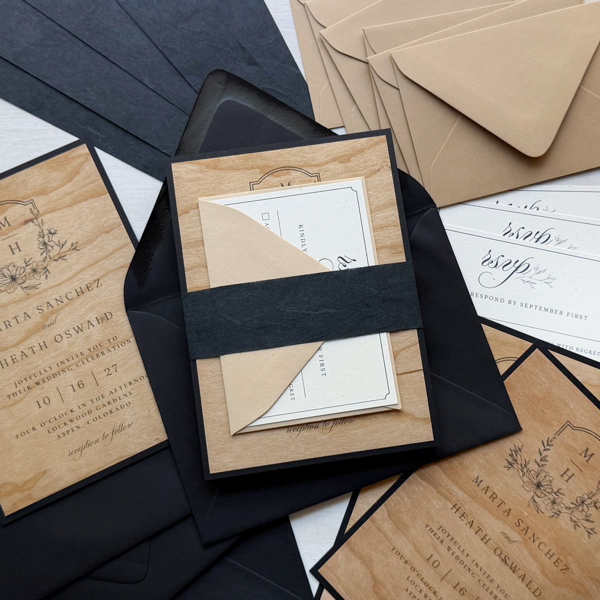 Wedding invitation with printed Wood Veneer flat cards, Madero Beach RSVP card, Black Thai Mulberry belly band, and Stone and Sirio Ultra Black envelopes