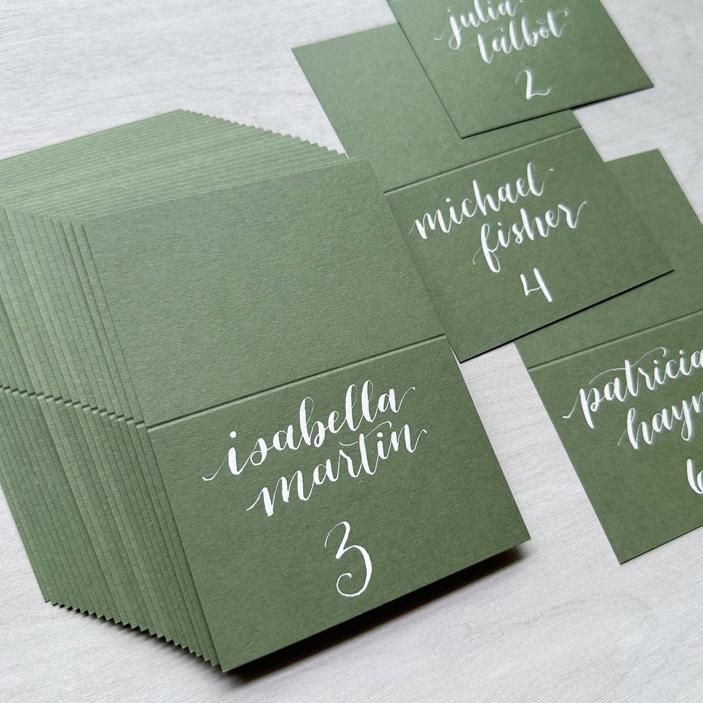 mid green calligraphy place cards